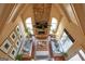 A bird's eye view of a living room with stone fireplace and vaulted ceilings at 1345 Cashiers Way, Roswell, GA 30075