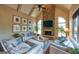 Bright living room with stone fireplace, vaulted ceiling, and comfortable seating at 1345 Cashiers Way, Roswell, GA 30075