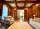 Elegant room with coffered wood ceiling, hardwood floors, and french doors to dining room at 1345 Cashiers Way, Roswell, GA 30075