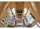 Aerial view of cozy living room with fireplace, vaulted ceiling, and comfortable seating at 1345 Cashiers Way, Roswell, GA 30075