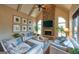 Cozy living room featuring vaulted ceilings and stone fireplace at 1345 Cashiers Way, Roswell, GA 30075