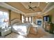 Bright main bedroom boasts a tray ceiling, fireplace, and sitting area with plush carpet at 1345 Cashiers Way, Roswell, GA 30075