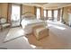 Spacious main bedroom features a tray ceiling, sitting area, fireplace, and natural light at 1345 Cashiers Way, Roswell, GA 30075