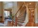 Grand foyer with curved staircase and wood floors at 1345 Cashiers Way, Roswell, GA 30075
