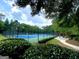 Well-maintained community tennis court with lush landscaping and a gazebo at 1345 Cashiers Way, Roswell, GA 30075