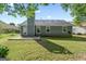 Exterior of home shows a well-maintained yard, patio, and windows highlighting the home's outdoor appeal at 135 Gingercake Ct, Fayetteville, GA 30214