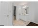 Bright bathroom with marble floors, vanity with drawers, and door to hall at 135 Gingercake Ct, Fayetteville, GA 30214