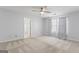 Spacious bedroom with plush carpeting, neutral walls, and a ceiling fan at 135 Gingercake Ct, Fayetteville, GA 30214