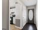 Inviting entryway showcasing hardwood floors and views of the kitchen at 135 Gingercake Ct, Fayetteville, GA 30214