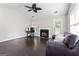 Bright living room with vaulted ceilings, fireplace, and dark hardwood floors at 135 Gingercake Ct, Fayetteville, GA 30214