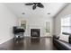 Bright living room with vaulted ceilings, fireplace, and dark hardwood floors at 135 Gingercake Ct, Fayetteville, GA 30214