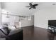 Open-plan living area with dark floors, vaulted ceiling, and kitchen access at 135 Gingercake Ct, Fayetteville, GA 30214