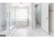 Luxurious bathroom with a freestanding tub, glass shower, and elegant fixtures at 8575 Haven Wood Trl, Roswell, GA 30076