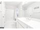 Bright bathroom with tub, shower, and double vanity, offers a clean and modern look at 8575 Haven Wood Trl, Roswell, GA 30076