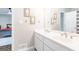 Charming bathroom boasts a double vanity, decorative wall art, and a clean, modern aesthetic at 8575 Haven Wood Trl, Roswell, GA 30076