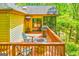 Outdoor deck with fire pit, grill, and seating area perfect for entertaining or relaxing at 8575 Haven Wood Trl, Roswell, GA 30076