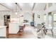 Bright kitchen with an island, seating, and an adjacent dining area perfect for gatherings at 8575 Haven Wood Trl, Roswell, GA 30076