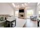 Bright living room features vaulted ceilings, a stone fireplace, and large windows at 8575 Haven Wood Trl, Roswell, GA 30076