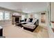 Inviting living room features a stone fireplace, plush seating, and ample natural light at 8575 Haven Wood Trl, Roswell, GA 30076