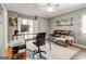 Comfortable office space complete with custom desk, cozy couch and ample natural light at 8575 Haven Wood Trl, Roswell, GA 30076