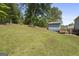 The home's backyard features a large yard, deck, and shed at 6942 Cottonwood Trl, Riverdale, GA 30296