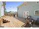 A spacious backyard deck includes lights overhead and an outdoor seating area at 6942 Cottonwood Trl, Riverdale, GA 30296
