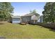 The home's backyard features a large yard, deck, and shed at 6942 Cottonwood Trl, Riverdale, GA 30296