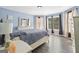 A primary bedroom features wood-look floors, natural light, and neutral walls at 6942 Cottonwood Trl, Riverdale, GA 30296