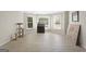 Bonus room with light tile floors and bright windows showcasing backyard views at 6942 Cottonwood Trl, Riverdale, GA 30296