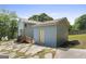 The home's exterior has a shed in the backyard at 6942 Cottonwood Trl, Riverdale, GA 30296