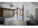 The spacious garage has a grey door and ample storage at 6942 Cottonwood Trl, Riverdale, GA 30296