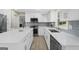 Bright kitchen with white cabinets, stainless appliances, subway tile backsplash, and a large island at 6942 Cottonwood Trl, Riverdale, GA 30296