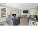 Cozy living room with a fireplace, comfortable seating, and a mounted TV for modern comfort at 6942 Cottonwood Trl, Riverdale, GA 30296
