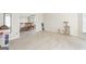 Spacious living room with light tile floors and an open view into the dining area at 6942 Cottonwood Trl, Riverdale, GA 30296