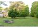 Expansive backyard with well-maintained lawn and framed garden beds at 17 Hampton Way, Carrollton, GA 30116
