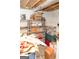 Unfinished basement with storage shelves, boxes, and green storage bins at 17 Hampton Way, Carrollton, GA 30116