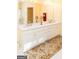 Bathroom with double vanity, wall to wall mirror, and ornate carpet at 17 Hampton Way, Carrollton, GA 30116
