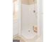 Shower with white tile, a rainfall showerhead, and a basket of towels at 17 Hampton Way, Carrollton, GA 30116