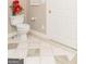 Traditional bathroom featuring patterned tile flooring and a white toilet with floral decorations on the tank at 17 Hampton Way, Carrollton, GA 30116