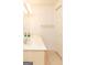 Bathroom features a long vanity with double sinks, large mirror, and storage closet at 17 Hampton Way, Carrollton, GA 30116