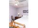 Comfortable bedroom with a ceiling fan and two floral art pieces at 17 Hampton Way, Carrollton, GA 30116