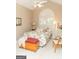 Vaulted ceiling bedroom with a decorative window, bed, and white furniture at 17 Hampton Way, Carrollton, GA 30116