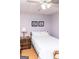 This bedroom has a ceiling fan and is decorated with floral art at 17 Hampton Way, Carrollton, GA 30116