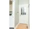 Entryway with a wooden door, wood floors, and utility room view at 17 Hampton Way, Carrollton, GA 30116