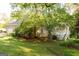 Exterior of a home featuring a wooden deck, garage and a well-manicured lawn at 17 Hampton Way, Carrollton, GA 30116