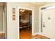 Foyer view flowing into dining room showcasing hardwood floors and a bright, welcoming ambiance at 17 Hampton Way, Carrollton, GA 30116