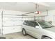 Attached two-car garage features two doors with an SUV parked inside at 17 Hampton Way, Carrollton, GA 30116