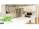 Bright kitchen with stainless steel appliances, ample counter space, and white cabinetry at 17 Hampton Way, Carrollton, GA 30116