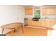 Open concept kitchen featuring a dining area and light wood cabinets at 17 Hampton Way, Carrollton, GA 30116