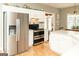 Spacious kitchen with stainless steel appliances and a kitchen island, perfect for cooking and entertaining at 17 Hampton Way, Carrollton, GA 30116
